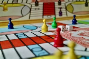 Colorful game pieces and dice on a board game