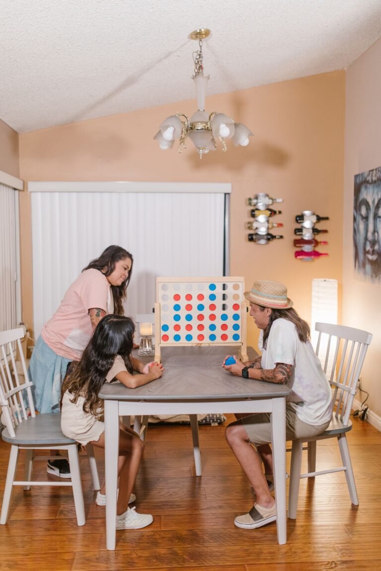 Family playing a board game together at home