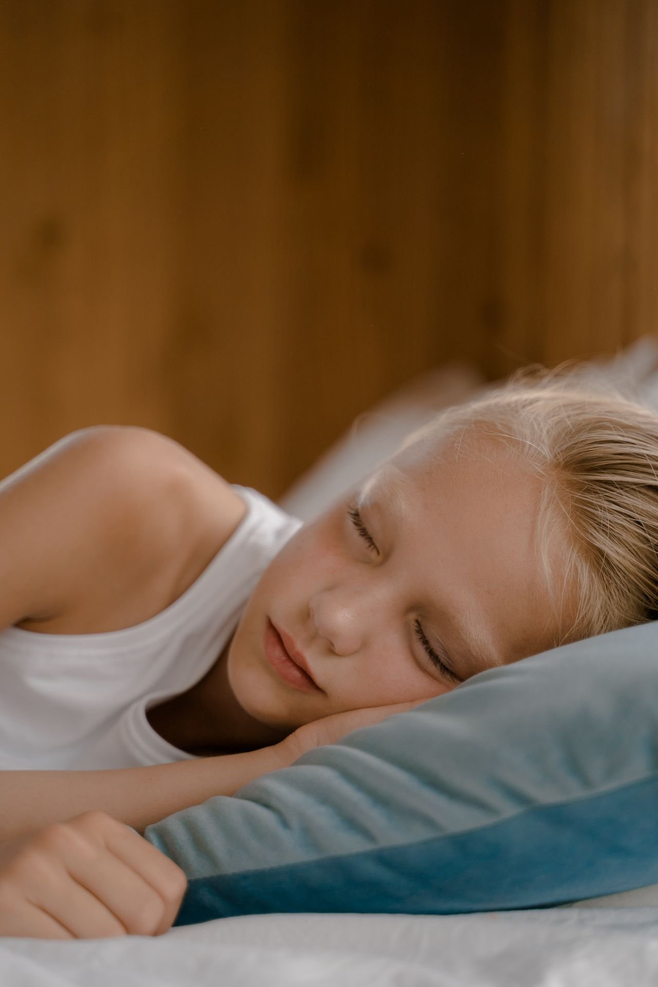 Child sleeping peacefully in bed