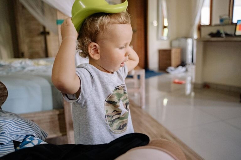 Young boy playing indoors in his bedroom