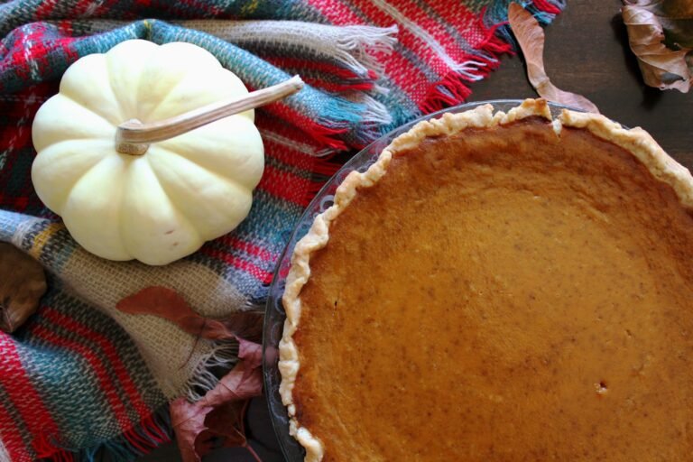 A pumpkin pie sitting on a table